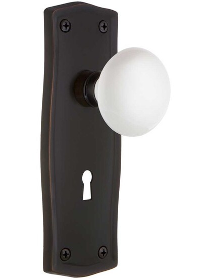 Prairie Style Door Set With White Porcelain Door Knobs in Timeless Bronze.